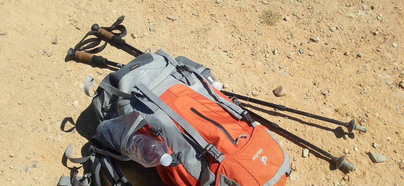 Hiking poles and backpack